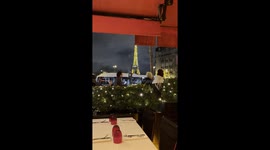 Eiffel Tower in Paris at night from a restaurant during the light show