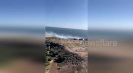 US: Flames Cross Highway And Threaten Beachside Vegetation Near Gaviota