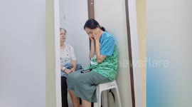 Maid prays with elderly resident in Israel during missile bombardment