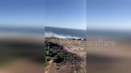 Vegetation fire engulfs fields along Highway 101 in California