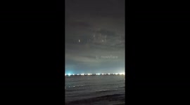 China: Mysterious Vertical Lights Appear Over Hainan Night Sky