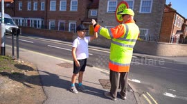 School lollipop man told he can't 'high five
