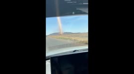 Dust devil spotted near road in Arizona, USA