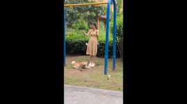 Woman accidentally kicks excited dog while swinging in Hunan, China