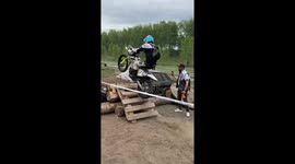 Motorcyclist breaks windshield while crossing over vehicle in Siberia, Russia