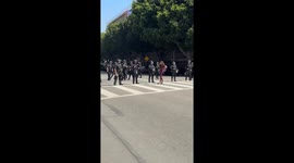 Daisy the Venice Healer skates with megaphone during No Kings-ICE protest in Los Angeles, USA