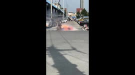 High-voltage wire sparks on road, people keep distance in Guangdong, China
