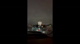 Man Sitting on Truck Bed Throne