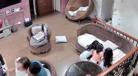 Mother topples over backwards when she sits on new chair