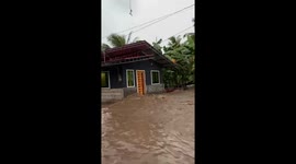 Strong flood sweeps through streets after heavy rain in Bansalan, Davao del Sur, Philippines