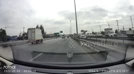 Motorcycle Crashes into Car on Freeway