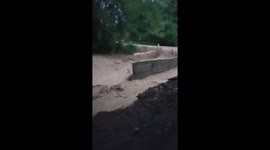 A sudden flash flood destroyed roads, caused landslides and destroyed hundreds of houses