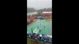 Basketball game continues on submerged court in Guizhou, China