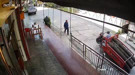 Overloaded tricycle lifts front wheel and spills logs in Sichuan, China