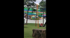 Hapless dad topples from playground swing while watching children