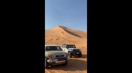 Off-road vehicle gets stuck in sand dune in Riyadh, Saudi Arabia