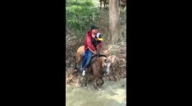 Horseback riding fail in muddy river in Córdoba, Colombia