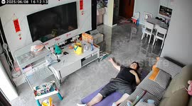 Funny moment as daughter accidentally falls on sleeping father in Shanxi, China