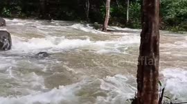 Heavy rain triggers flash floods submerging roads in eastern Thailand