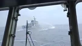 China Coast Guard fires water cannon and blocks Filipino ship