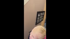 Loving sister excitedly brings home a gift for her baby brother