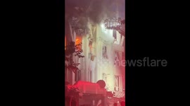 Iran: A building allegedly targeted by an Israeli strike is destroyed and is burning in Tehran
