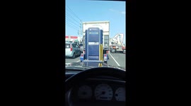Using a Portable Toilet Being Towed in Traffic