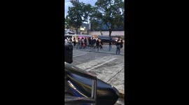 Commuters surround jeepney for morning rush in Manila