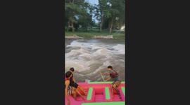 White water raft flips over at river resort