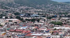 Oaxaca de Juárez, a city in central Mexico, features colonial buildings, many of which are in the Zócalo, the central square, and the Government Palace, with colorful murals depicting regional history. The Alameda de León square faces the ornate facade of