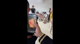 Thai man styles his makeup on picture of a monkey