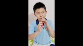 Blind child plays tune through a straw