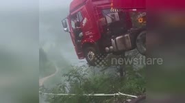 China bridge collapse leaves truck hanging perilously over drop