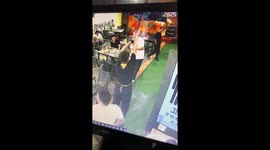 Water falls from tent roof onto worker during storm in China