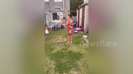 Funny moment woman's underwear falls down while skipping