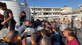 Palestinians line up for clean water as aid blockade continues in Gaza Strip