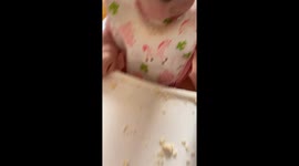 cat and baby share lunch