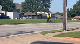 Landscaper Whacks Weeds on a Segway