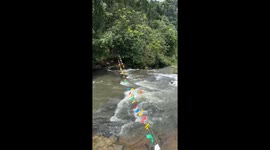 Onlooker saves puppy washed over 150ft waterfall in Laos