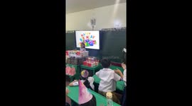 Energetic schoolboy throws serious shapes for classmate's Happy Birthday song