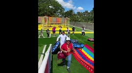 Priest joyfully plays like a child at adventure park in Lipa, Batangas, Philippines