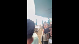 Waterspout spotted offshore near beach restaurant in Holmes Beach, Florida, USA