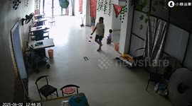 Sister pulls sibling to safety as car crashes into restaurant in Henan, China