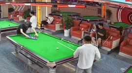 Cue ball jumps to another table and hits phone in Anhui, China