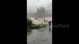 Passengers make narrow escape as minibus is swept away by raging floodwater in China