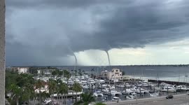 Spectacular twin waterspouts seen towering over river in Florida