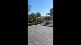 Amusing moment robot dog trips while climbing steps on campus