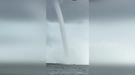 Under The Storm Twin Waterspouts Rise Before Shocked Florida Boaters
