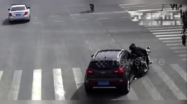 China: Electric Bike Keeps Riding Through Crash Scene After Cyclist Falls