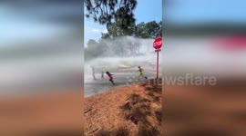 Children cool off under fire hydrants in North Carolina